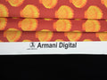 Fabric with shell pattern and Armani Digital branding on a black background